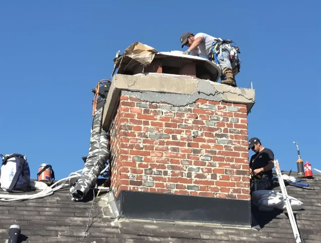 Norton Chimney Sweep installing a custom chimney crown in Norton, OH