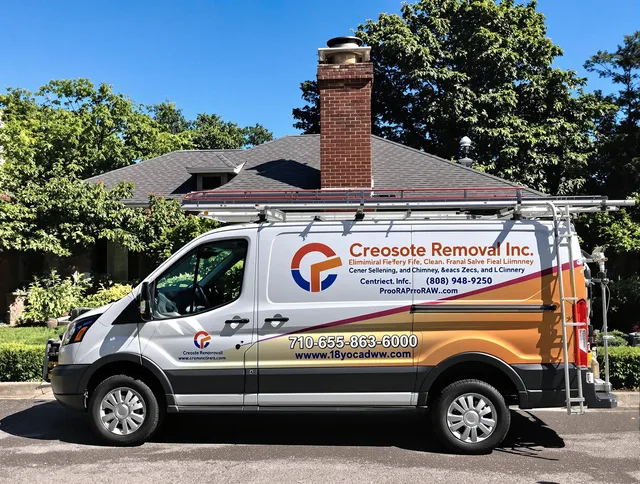 Norton Chimney Sweep technician removing creosote safely in Norton, OH