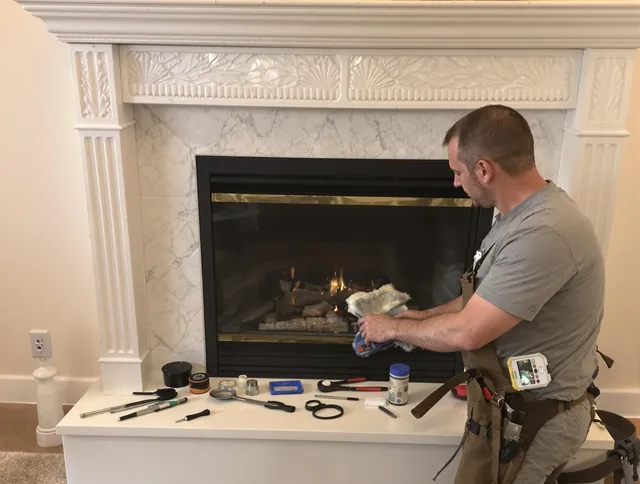 Norton Chimney Sweep performing fireplace maintenance in Norton, OH
