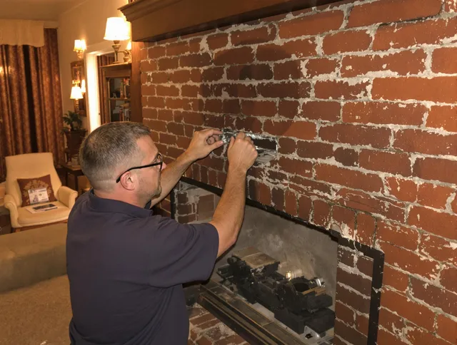 Norton Chimney Sweep expert fixing a fireplace in Norton, OH